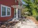 Red house exterior with front porch and steps at 1411 Lineberger Ave, Gastonia, NC 28052