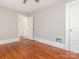 Hardwood floor bedroom with access to upper hallway and closet at 1411 Lineberger Ave, Gastonia, NC 28052