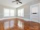 Hardwood floors and neutral walls in this spacious living room at 1411 Lineberger Ave, Gastonia, NC 28052