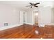 Large bedroom with hardwood floors and access to a bathroom at 1411 Lineberger Ave, Gastonia, NC 28052
