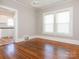 Dining room with hardwood floors and view into the kitchen at 1411 Lineberger Ave, Gastonia, NC 28052