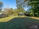 Spacious backyard with grassy area and trees at 1411 Lineberger Ave, Gastonia, NC 28052