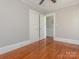 Spacious bedroom with hardwood floors and access to upper hallway at 1411 Lineberger Ave, Gastonia, NC 28052