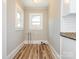 Laundry area with hookups and light wood flooring at 1411 Lineberger Ave, Gastonia, NC 28052