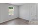 Bright bedroom with large window and neutral colored walls at 3221 Maple Ridge Dr, Gastonia, NC 28052