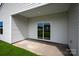 Covered patio with sliding glass door leading to backyard at 3221 Maple Ridge Dr, Gastonia, NC 28052