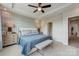Spacious main bedroom with king-size bed, ensuite bathroom access, and ample natural light at 3244 Stelfox St, Charlotte, NC 28262