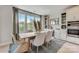 Light-filled dining area with a wooden table and built-in cabinetry at 3244 Stelfox St, Charlotte, NC 28262