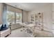 Bright home office features a desk, shelving, and comfortable seating at 3244 Stelfox St, Charlotte, NC 28262
