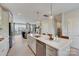 Open kitchen with large island, stainless steel appliances, and view to living area at 3244 Stelfox St, Charlotte, NC 28262