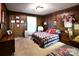 Cozy bedroom featuring wood-paneled walls and a queen bed at 329 E Allenton St, Mount Gilead, NC 27306