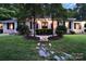 Brick ranch home with landscaped lawn and stone pathway at 329 E Allenton St, Mount Gilead, NC 27306