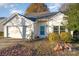 Front view of a cozy house with a two-car garage and landscaping at 4700 Aldersbrook Dr, Monroe, NC 28110