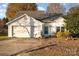 One-story house with a two-car garage and autumn landscaping at 4700 Aldersbrook Dr, Monroe, NC 28110