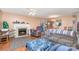 Living room with fireplace, sectional sofa and hardwood floors at 4700 Aldersbrook Dr, Monroe, NC 28110