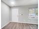 Bright entryway with wood-look floors and white door at 5407 Kimmerly Woods Dr, Charlotte, NC 28215