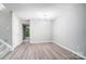 Bright dining room with hardwood floors and modern light fixture at 5407 Kimmerly Woods Dr, Charlotte, NC 28215