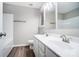 Modern bathroom with double vanity, white cabinets and a bathtub at 5407 Kimmerly Woods Dr, Charlotte, NC 28215