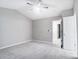 Spacious bedroom with ceiling fan and neutral paint at 5407 Kimmerly Woods Dr, Charlotte, NC 28215