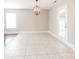 Bright dining area with tile flooring and a modern chandelier at 612 Carybrook Ct, York, SC 29745