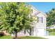 Two-story house with gray siding, a two-car garage, and a large tree in the front yard at 612 Carybrook Ct, York, SC 29745