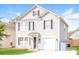 Two-story house with gray siding, a two-car garage, and a well-maintained lawn at 612 Carybrook Ct, York, SC 29745