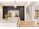 Modern kitchen with white island, dark cabinetry and a breakfast bar area at 1017 Maxwell Ct # 5, Marvin, NC 28173