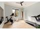 Bright home gym with Peloton bike, treadmill, and punching bag at 1017 Maxwell Ct # 5, Marvin, NC 28173