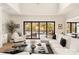 Open living space with large windows, a comfy seating area and access to a patio at 1017 Maxwell Ct # 5, Marvin, NC 28173
