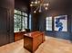 Sophisticated home office with dark walls, hardwood floors, and large windows at 1401 Heather Ln, Charlotte, NC 28209
