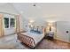 Spacious bedroom with a large window and stylish decor at 1401 Heather Ln, Charlotte, NC 28209