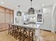 Modern kitchen with large island, white cabinets, and high-end appliances at 1401 Heather Ln, Charlotte, NC 28209