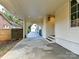 Covered walkway leading to a detached garage with an arched entryway at 1401 Heather Ln, Charlotte, NC 28209