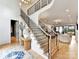 Bright entryway with stylish console table and staircase leading to upper level at 1401 Heather Ln, Charlotte, NC 28209