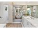 Luxurious Primary bathroom with a soaking tub, walk-in shower, and double vanity at 1401 Heather Ln, Charlotte, NC 28209