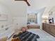 Bedroom with crib, daybed, and ample closet space at 1401 Heather Ln, Charlotte, NC 28209