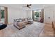 Spacious playroom with large sectional sofa and plush rug at 1401 Heather Ln, Charlotte, NC 28209