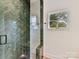 Spa-like shower with herringbone tile, glass enclosure, and built-in bench at 1401 Heather Ln, Charlotte, NC 28209