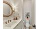 Stylish powder room with a unique sink, patterned wallpaper, and modern fixtures at 1401 Heather Ln, Charlotte, NC 28209