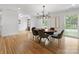 Elegant dining room with hardwood floors and modern chandelier at 4220 Brookfield Dr, Charlotte, NC 28210