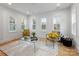 Bright living room with hardwood floors, large windows, and stylish seating at 4220 Brookfield Dr, Charlotte, NC 28210