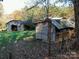 Two rustic outbuildings on a grassy lot at 4495 King Wilkinson Rd, Denver, NC 28037