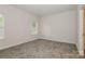 Bright bedroom with neutral carpeting and ample natural light at 469 Oates St, Rock Hill, SC 29730
