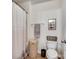 Clean bathroom with shower/tub combo and updated fixtures at 8509 Loxton Cir, Charlotte, NC 28214