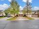 Townhome complex with multiple units and parking at 8509 Loxton Cir, Charlotte, NC 28214