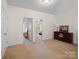 Upstairs hallway with access to bedrooms and a media room at 8509 Loxton Cir, Charlotte, NC 28214