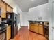 Kitchen with wood cabinets, granite countertops, and a breakfast bar at 8509 Loxton Cir, Charlotte, NC 28214