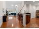 Open concept kitchen with breakfast bar and hardwood floors at 8509 Loxton Cir, Charlotte, NC 28214