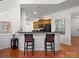 Kitchen features a breakfast bar with two red stools at 8509 Loxton Cir, Charlotte, NC 28214
