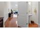 Small half bathroom with pedestal sink and open to hallway at 8509 Loxton Cir, Charlotte, NC 28214